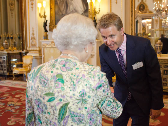 Oli Christie from Neon Play meeting The Queen