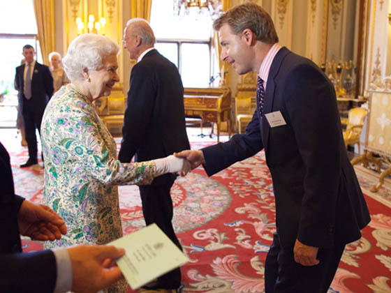 Oli Christie from Neon Play meeting The Queen
