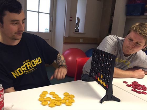 Neon Play team playing Connect 4