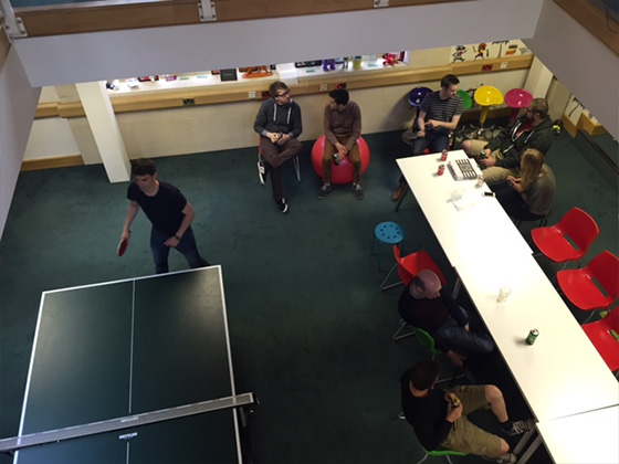 Neon Play team playing ping pong