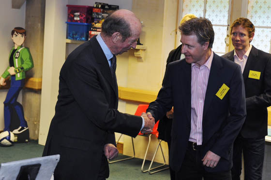 Duke of Kent shakes hands with Neon Play's CEO Oli Christie 